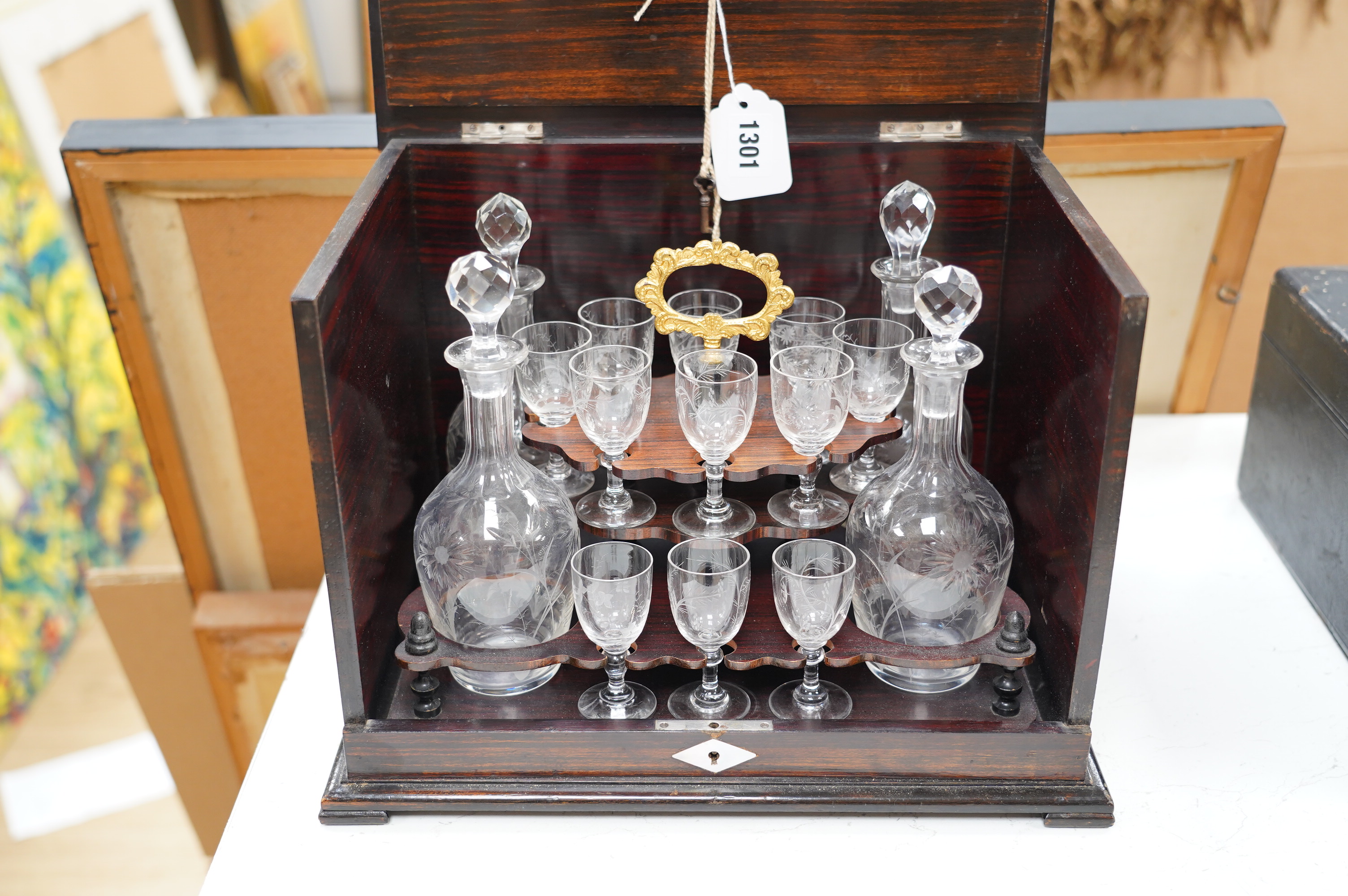 A Regency coromandel liqueur set with etched glasses and decanters, 33cm wide. Condition - fair to good